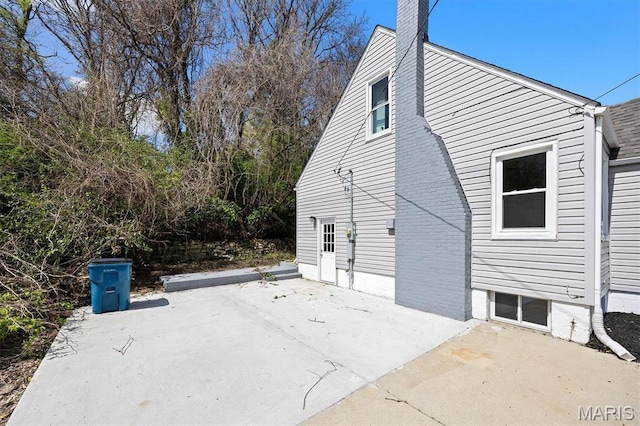 315 Meister St, Collinsville, IL 62234 - view of side of home with a patio and a chimney