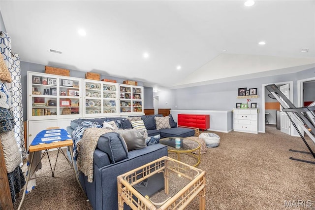 carpeted living area with vaulted ceiling and recessed lighting