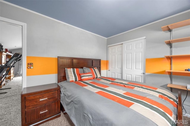 carpeted bedroom featuring a closet and crown molding