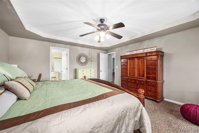 bedroom with carpet, a raised ceiling, baseboards, and ceiling fan