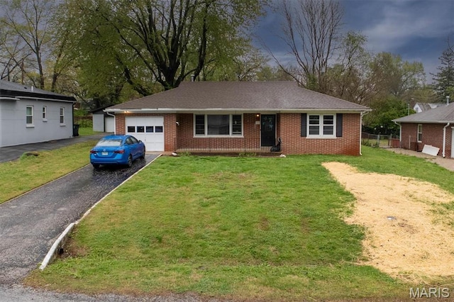 7 Lakewood Dr, Belleville, IL 62223 - ranch-style house featuring a garage, asphalt driveway, brick siding, and a front lawn
