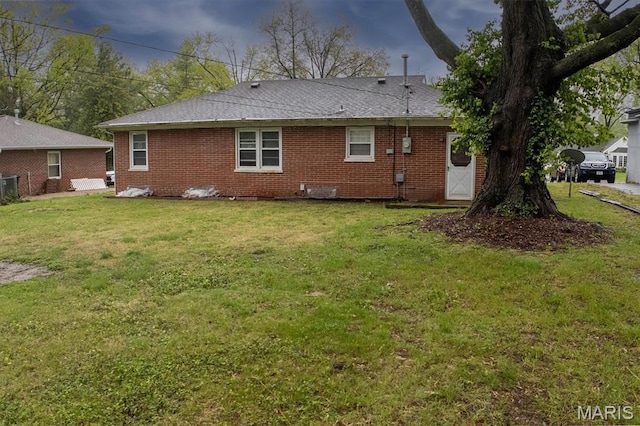 7 Lakewood Dr, Belleville, IL 62223 - back of property featuring brick siding, a lawn, and central air condition unit