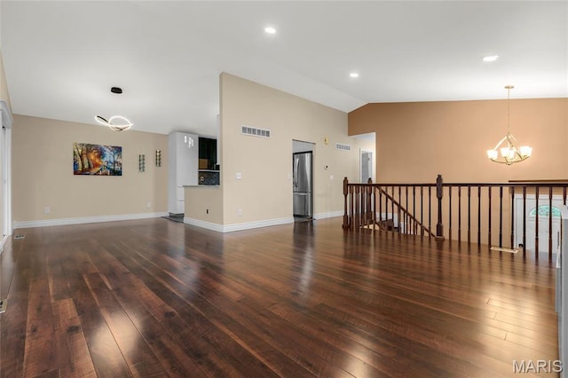 2022 Tramore Ct, Chesterfield, MO 63017 - unfurnished room with a chandelier, lofted ceiling, hardwood / wood-style floors, and baseboards