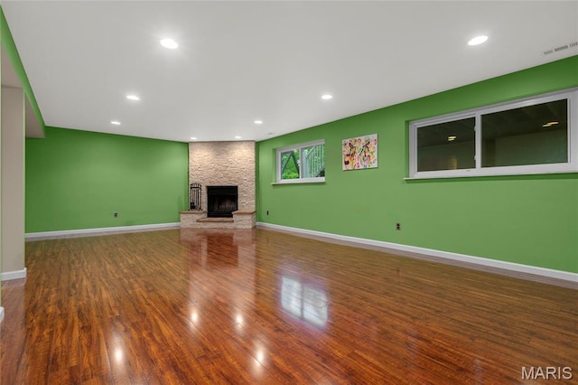 2022 Tramore Ct, Chesterfield, MO 63017 - unfurnished living room featuring wood finished floors, a fireplace, baseboards, and recessed lighting