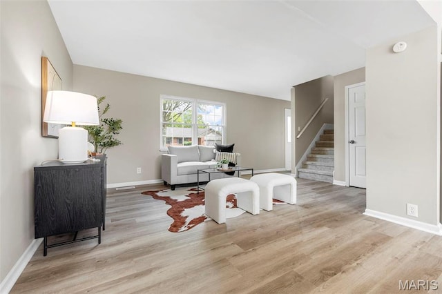 948 Barbara Ann Ln, Ellisville, MO 63021 - living area with light wood-style floors and stairs
