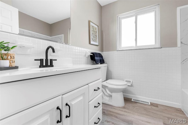 948 Barbara Ann Ln, Ellisville, MO 63021 - full bath with tile walls, vanity, and wood finished floors