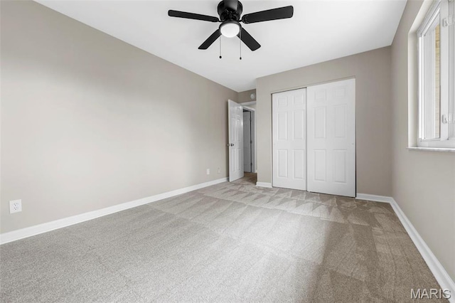 948 Barbara Ann Ln, Ellisville, MO 63021 - unfurnished bedroom featuring light carpet, a closet, and a ceiling fan