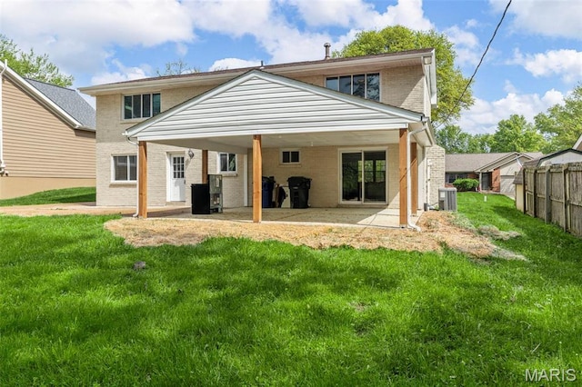 948 Barbara Ann Ln, Ellisville, MO 63021 - back of property featuring brick siding and a patio area
