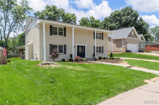 948 Barbara Ann Ln, Ellisville, MO 63021 - greek revival house featuring a garage, driveway, and brick siding