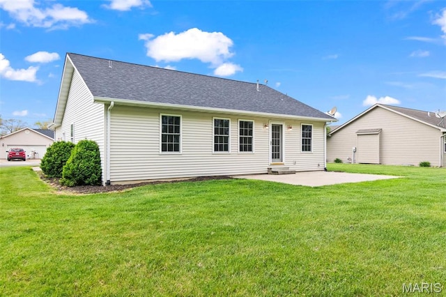 705 Fulton St, Gillespie, IL 62033 - back of property with a patio, a lawn, roof with shingles, and entry steps