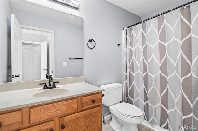705 Fulton St, Gillespie, IL 62033 - full bathroom with toilet, vanity, and a shower with curtain