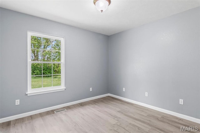 705 Fulton St, Gillespie, IL 62033 - empty room featuring wood finished floors and baseboards