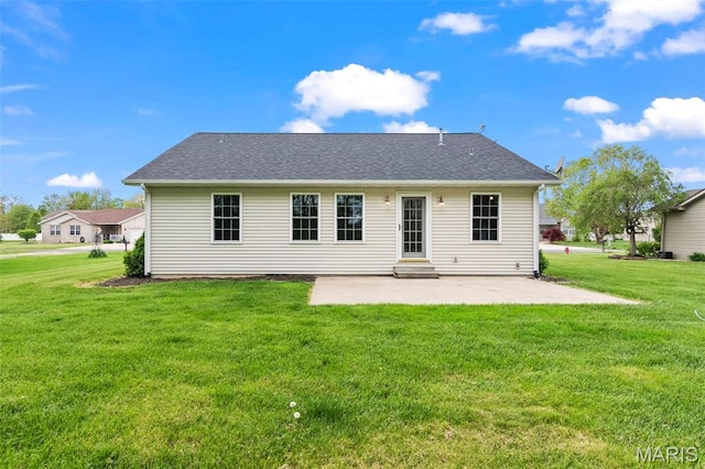 705 Fulton St, Gillespie, IL 62033 - rear view of property with a patio, a lawn, and roof with shingles