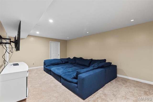 living room featuring carpet flooring, baseboards, and recessed lighting