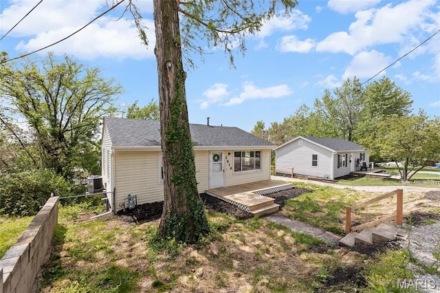 2619 Plainview Ter, Alton, IL 62002 - rear view of house with central AC, fence, a wooden deck, and roof with shingles