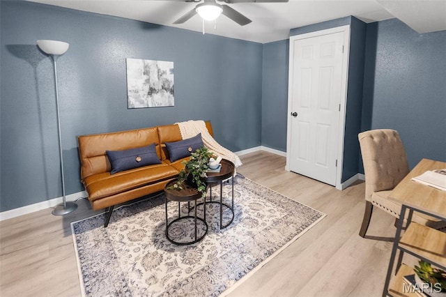 2619 Plainview Ter, Alton, IL 62002 - living room featuring a ceiling fan, light wood-style floors, and baseboards