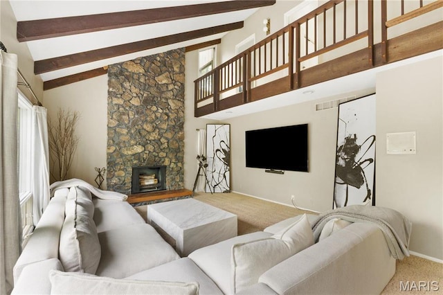 1626 Viola Dr, Imperial, MO 63052 - carpeted living area with beamed ceiling, high vaulted ceiling, baseboards, and a stone fireplace