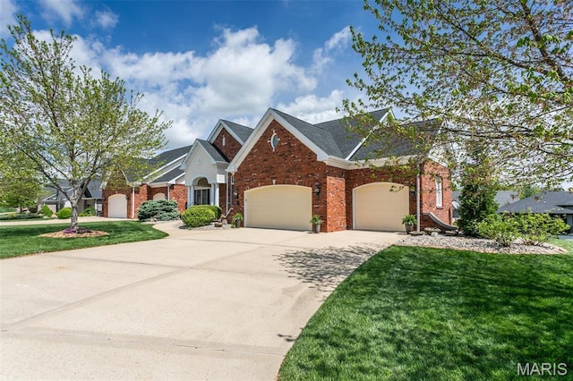 100 Waterfall Ct, Glen Carbon, IL 62034 - traditional-style house with an attached garage, brick siding, a front yard, and driveway