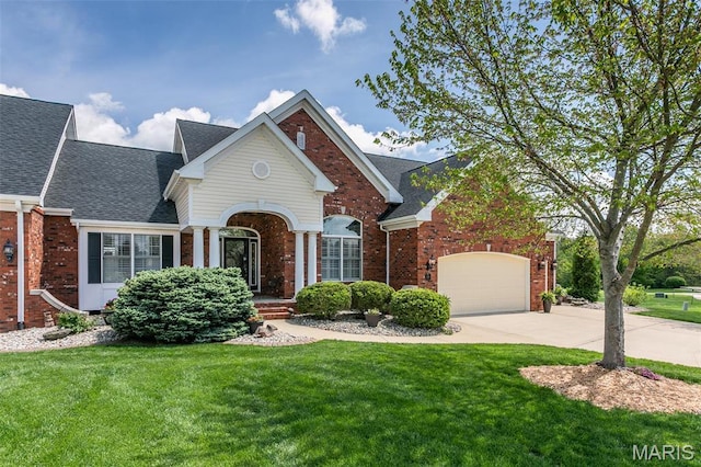 100 Waterfall Ct, Glen Carbon, IL 62034 - traditional home featuring brick siding, concrete driveway, and a front yard