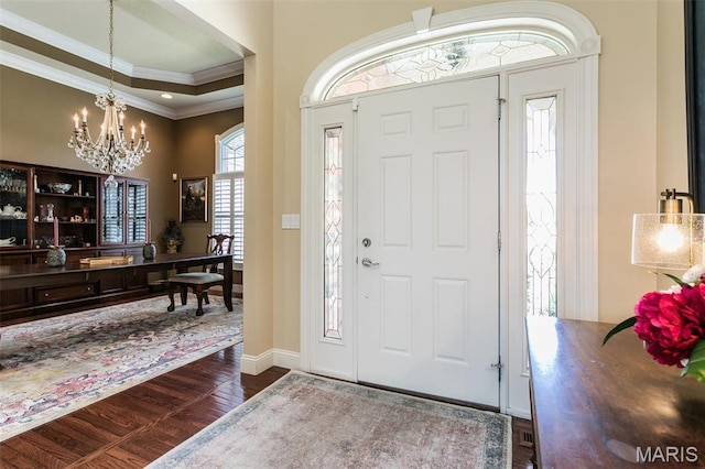 100 Waterfall Ct, Glen Carbon, IL 62034 - foyer featuring crown molding, wood finished floors, a chandelier, a towering ceiling, and baseboards