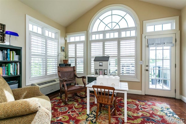 100 Waterfall Ct, Glen Carbon, IL 62034 - living area with healthy amount of natural light, vaulted ceiling, wood finished floors, and baseboards