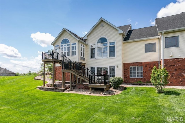 100 Waterfall Ct, Glen Carbon, IL 62034 - rear view of house with a deck, a lawn, stairs, and brick siding