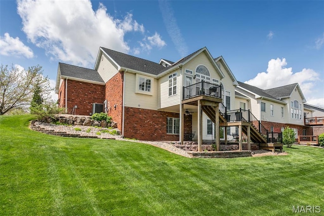 100 Waterfall Ct, Glen Carbon, IL 62034 - back of house with brick siding, stairway, a yard, and a wooden deck