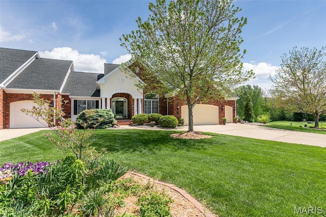100 Waterfall Ct, Glen Carbon, IL 62034 - traditional-style home with an attached garage, concrete driveway, brick siding, a front yard, and a shingled roof