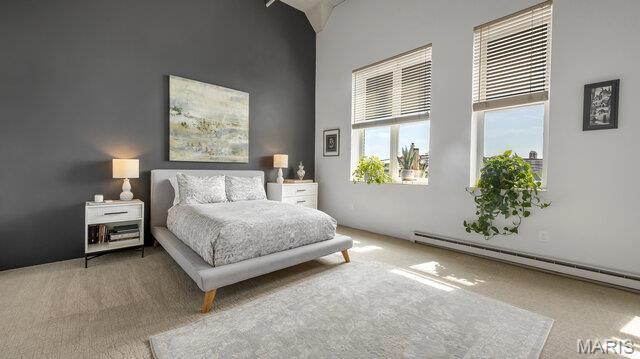 4100 Laclede Ave Unit 314, Saint Louis, MO 63108 - bedroom with carpet, a towering ceiling, and a baseboard heating unit