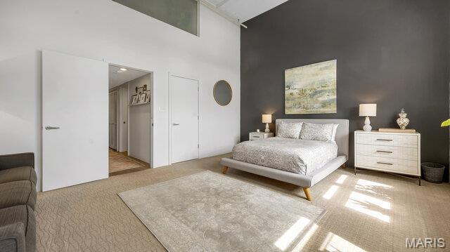 4100 Laclede Ave Unit 314, Saint Louis, MO 63108 - carpeted bedroom with a towering ceiling