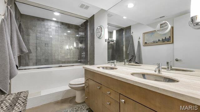4100 Laclede Ave Unit 314, Saint Louis, MO 63108 - full bath with toilet, double vanity, shower / bath combination with glass door, and recessed lighting