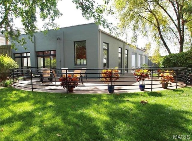 4100 Laclede Ave Unit 314, Saint Louis, MO 63108 - rear view of property with stucco siding and a lawn
