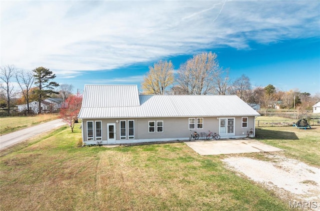 255 Walnut St, Edgar Springs, MO 65462 - rear view of property with a yard, metal roof, and a patio