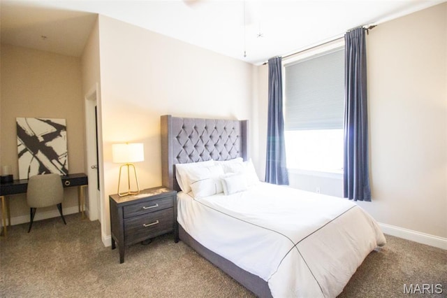 bedroom with light colored carpet and baseboards