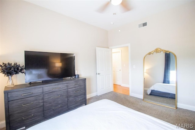 bedroom featuring baseboards, a ceiling fan, and carpet flooring