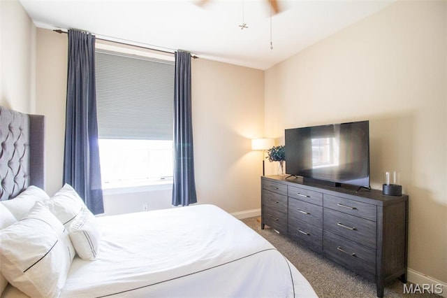 carpeted bedroom featuring baseboards