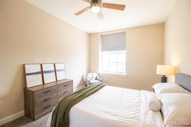 bedroom featuring baseboards, carpet flooring, and ceiling fan