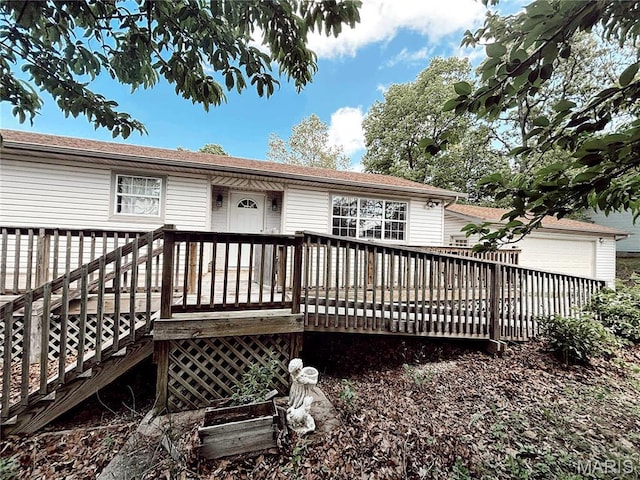 14075 Howard Ln, Dixon, MO 65459 - back of house with a garage and a deck