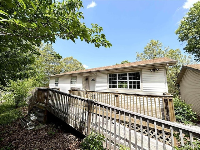 14075 Howard Ln, Dixon, MO 65459 - rear view of house with a wooden deck and a shingled roof
