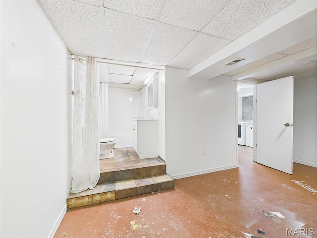 14075 Howard Ln, Dixon, MO 65459 - finished below grade area with a drop ceiling, washer and dryer, and baseboards