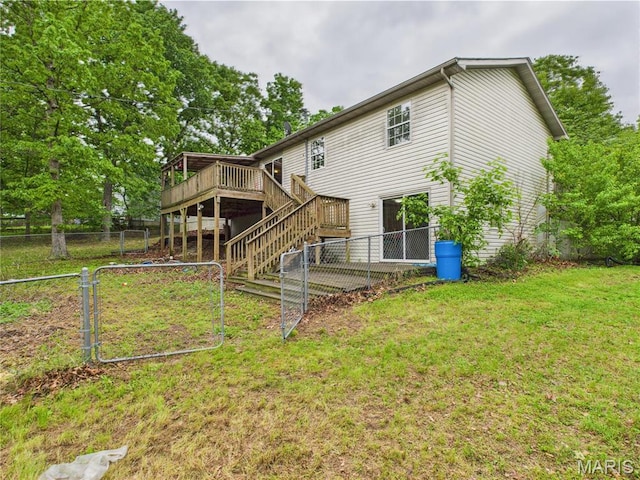 14075 Howard Ln, Dixon, MO 65459 - back of property with a deck, stairs, and a gate