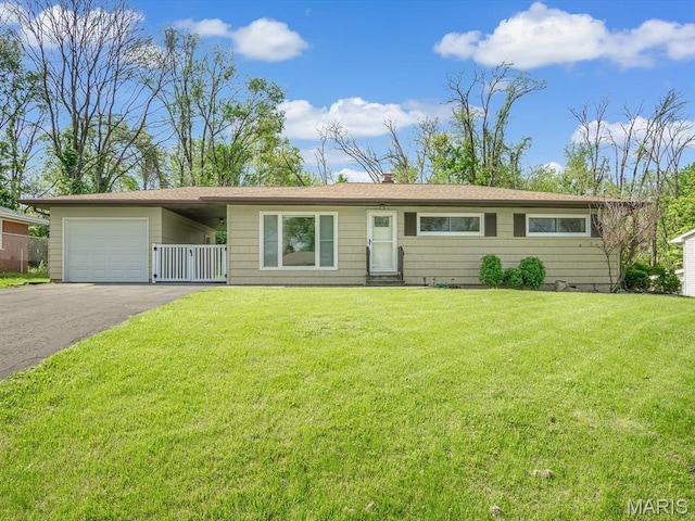 7320 Arke Dr, Belleville, IL 62223 - ranch-style house featuring a garage, asphalt driveway, and a chimney