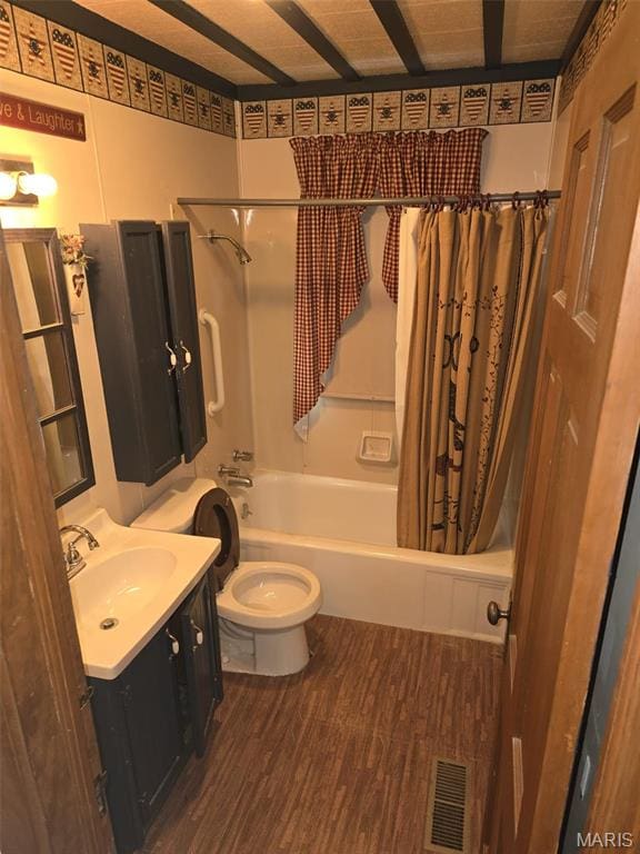 9332 Cloverhurst Dr, Saint Louis, MO 63123 - full bath with toilet, wood finished floors, vanity, and shower / bath combo with shower curtain