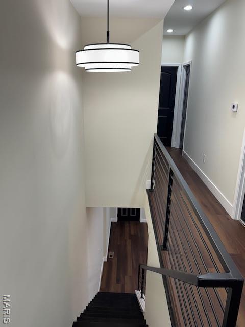 4209 Norfolk Ave, Saint Louis, MO 63110 - staircase featuring wood finished floors, baseboards, and recessed lighting