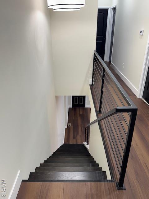 4209 Norfolk Ave, Saint Louis, MO 63110 - staircase with wood finished floors and baseboards