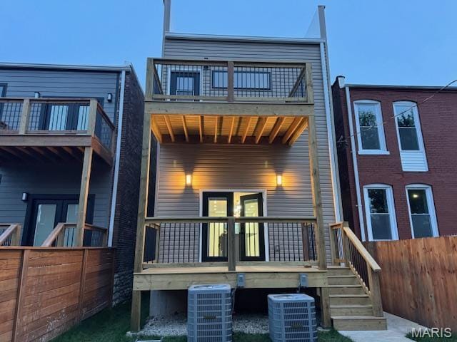 4209 Norfolk Ave, Saint Louis, MO 63110 - rear view of house with a balcony, fence, and central air condition unit