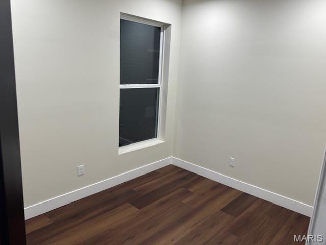 4209 Norfolk Ave, Saint Louis, MO 63110 - unfurnished room featuring dark wood finished floors and baseboards