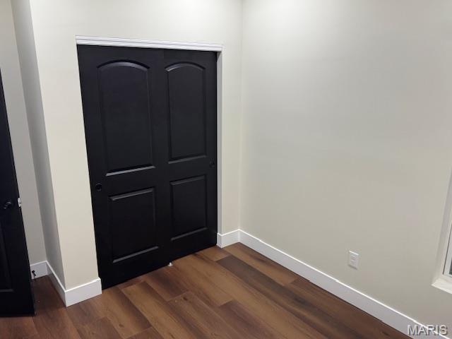 4209 Norfolk Ave, Saint Louis, MO 63110 - foyer entrance with baseboards and dark wood finished floors