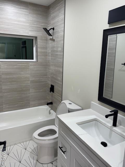 4209 Norfolk Ave, Saint Louis, MO 63110 - bathroom with toilet, shower / bathtub combination, tile patterned floors, and vanity