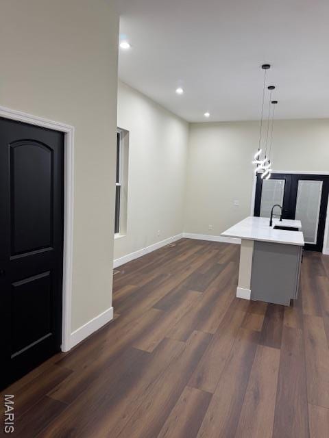 4209 Norfolk Ave, Saint Louis, MO 63110 - kitchen with dark wood-style floors, baseboards, light countertops, decorative light fixtures, and recessed lighting